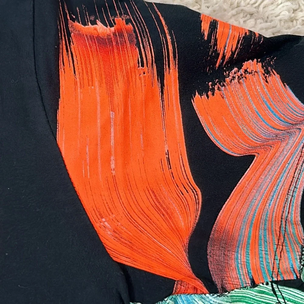 NIKE M LeBron James black shirt  with orange emblem and with bright sleeves
